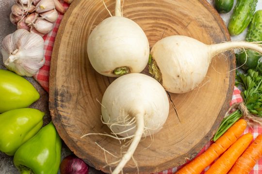 Top view fresh vegetables composition with radish on white background