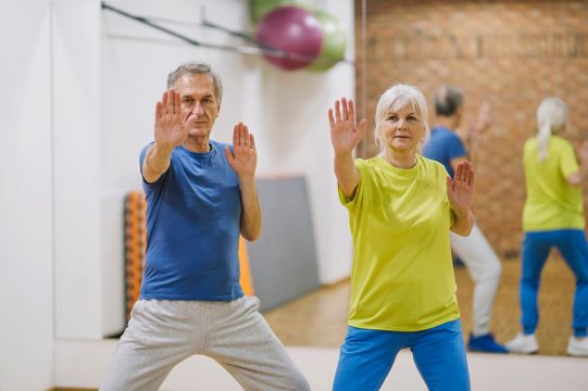 Retired couple doing exercises