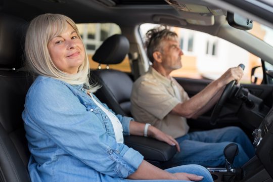 Medium shot couple in car