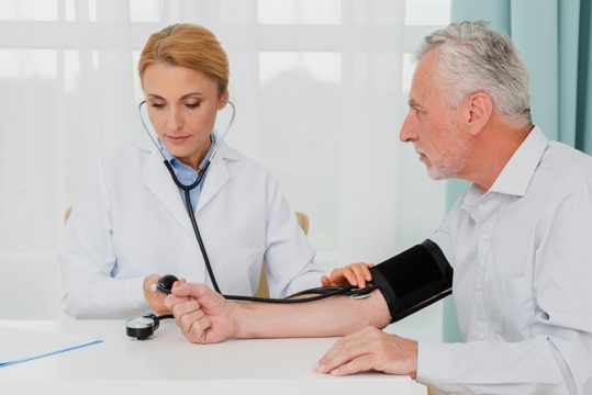Doctor examining blood pressure