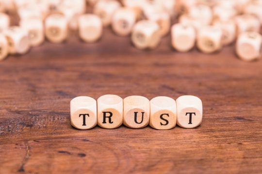 Trust word made with wooden blocks