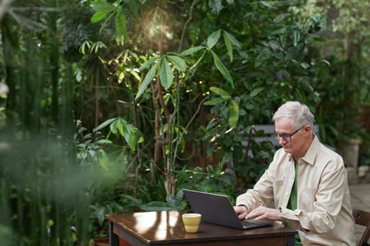 Man Busy Using His Laptop