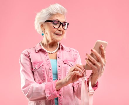 Stylish senior woman in pink