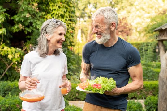 Medium shot senior couple with food