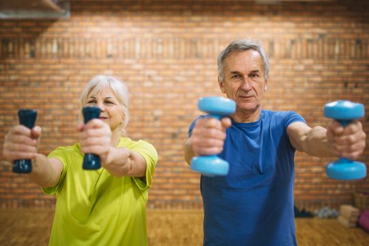 Older people training in gym