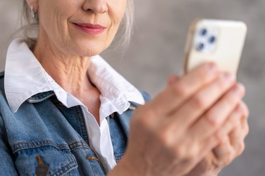 Portrait of senior woman using smartphone