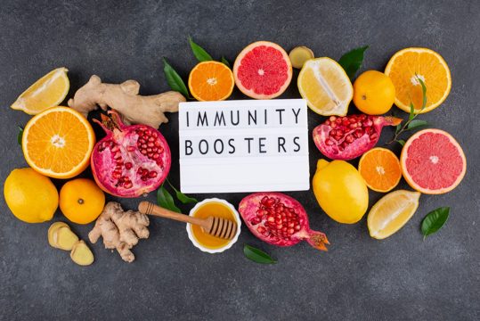 Flat lay of immunity boosting foods with citrus and ginger