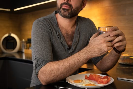 Side view man having breakfast