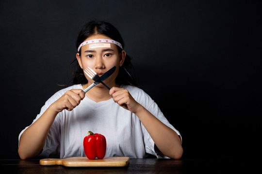 Depressed woman hungry from dieting